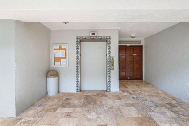 interior space featuring a textured ceiling