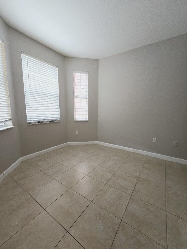 empty room featuring light tile patterned flooring