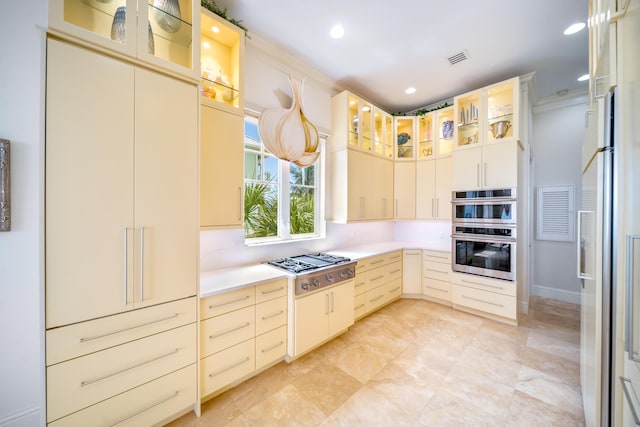 kitchen featuring stainless steel appliances and crown molding