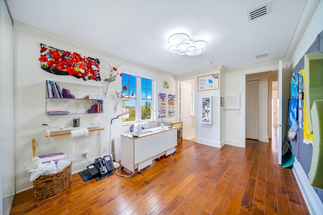 misc room with dark hardwood / wood-style floors and crown molding