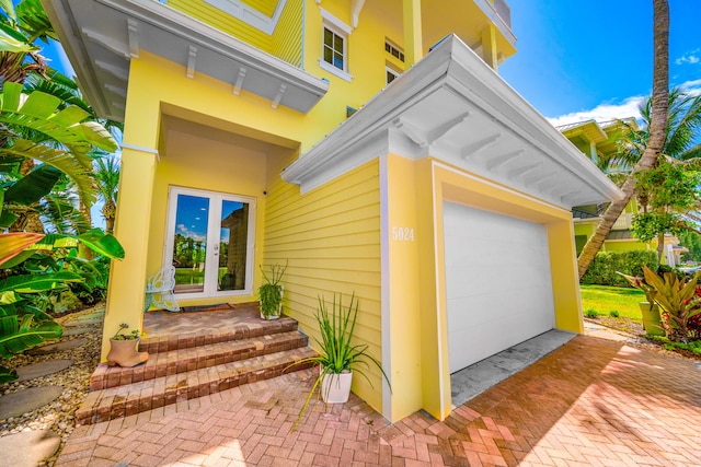 entrance to property featuring a garage