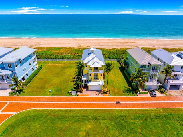 bird's eye view with a view of the beach and a water view