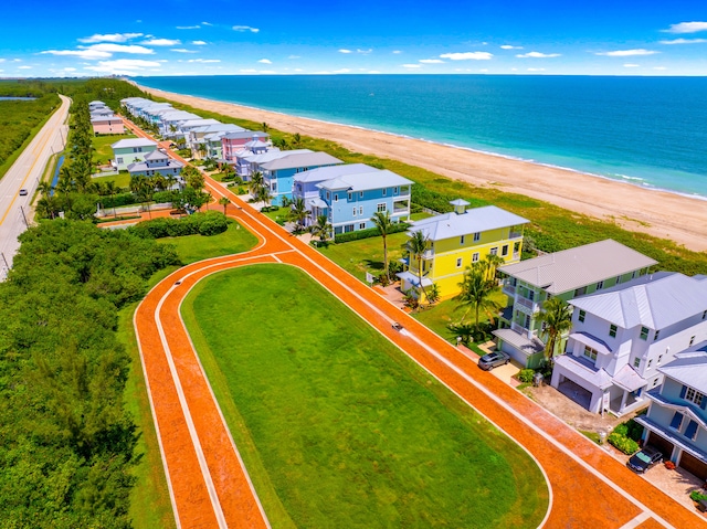 bird's eye view with a beach view and a water view