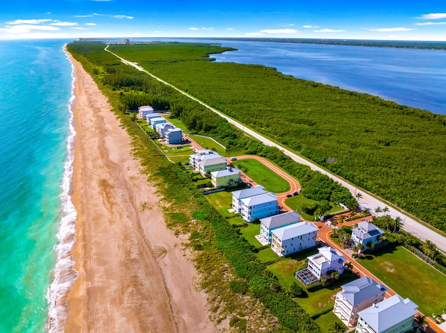 aerial view with a view of the beach and a water view