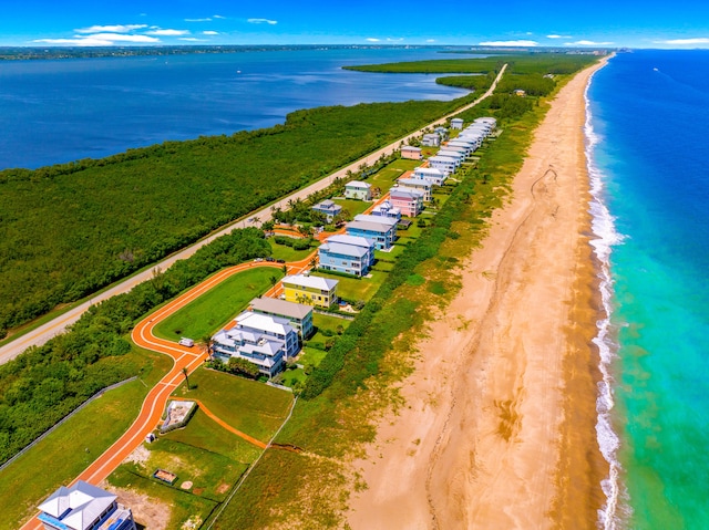 bird's eye view with a view of the beach and a water view