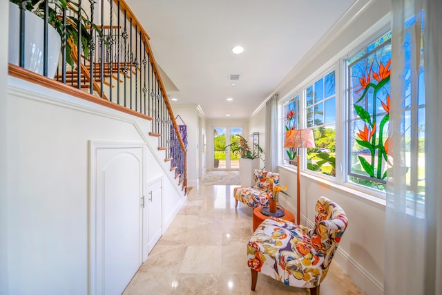 corridor featuring ornamental molding