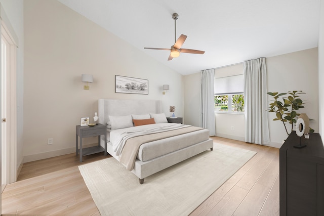 bedroom featuring ceiling fan, high vaulted ceiling, and light wood-type flooring