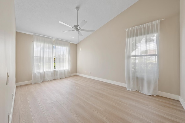 spare room featuring a textured ceiling, light hardwood / wood-style flooring, and ceiling fan