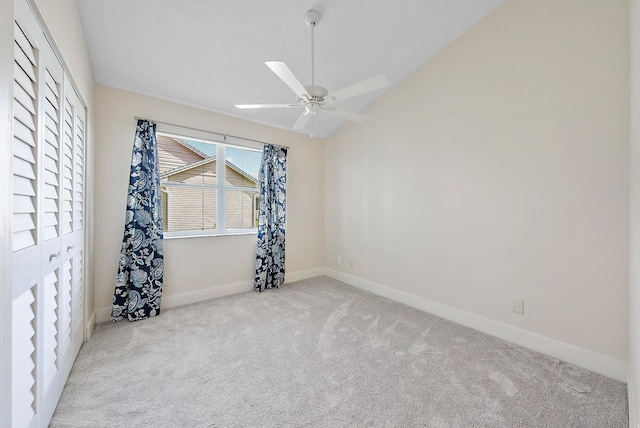 unfurnished room featuring light carpet and ceiling fan