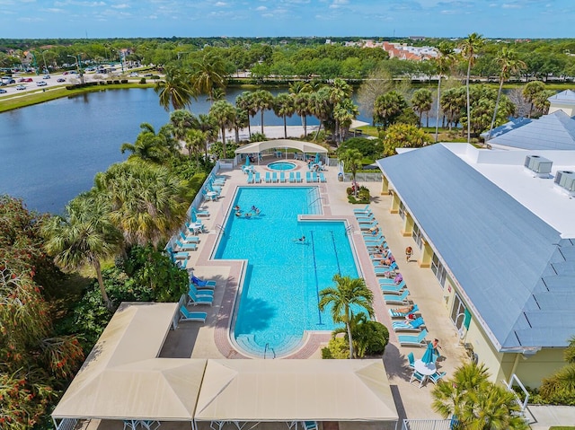 view of swimming pool with a water view