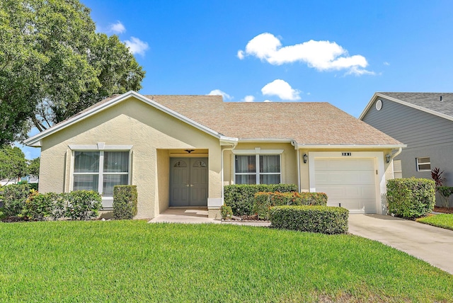 ranch-style home with a garage and a front yard