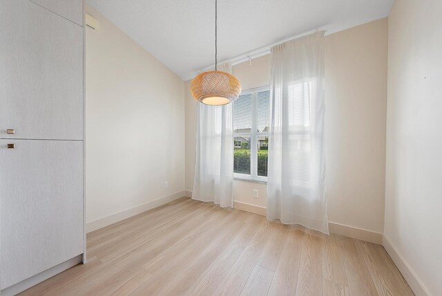 381 NW Sherry Ln, Port Saint Lucie, FL 34986 - unfurnished dining area with wood finished floors and baseboards