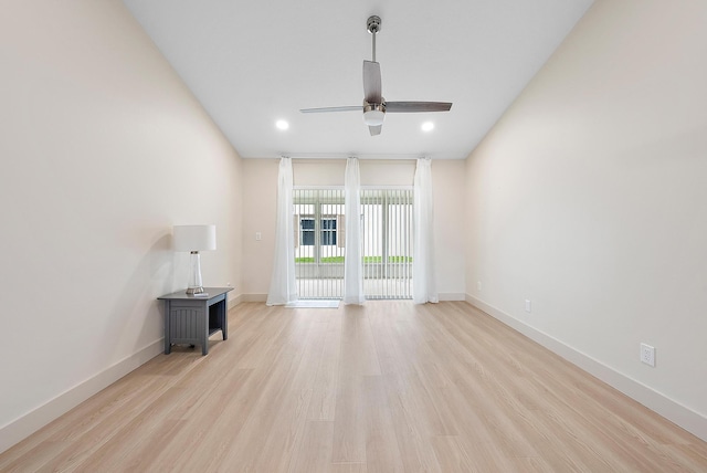 unfurnished living room featuring ceiling fan and light hardwood / wood-style flooring