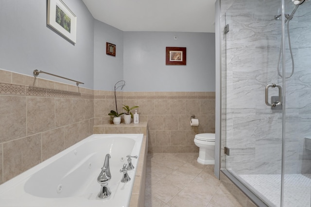 full bath with a whirlpool tub, a stall shower, tile patterned flooring, and tile walls