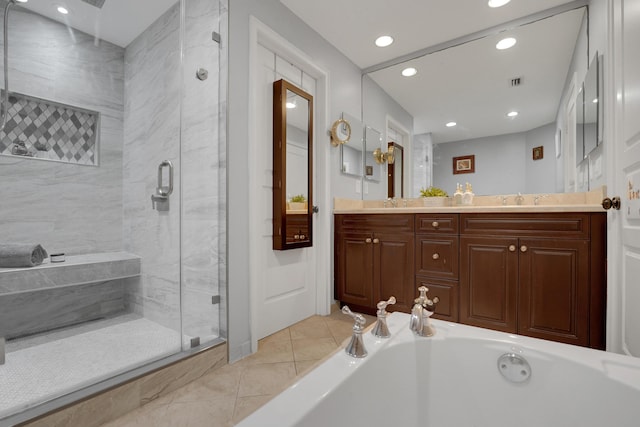 bathroom featuring double vanity, a stall shower, visible vents, a garden tub, and tile patterned flooring