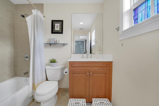 full bath with shower / tub combo with curtain, toilet, vanity, baseboards, and tile patterned floors