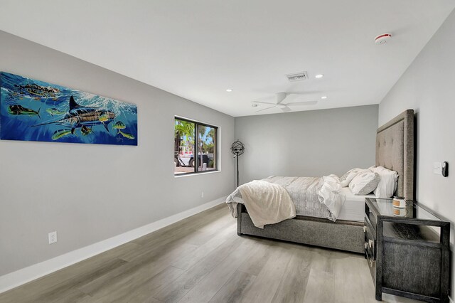 bedroom featuring ceiling fan and light hardwood / wood-style flooring