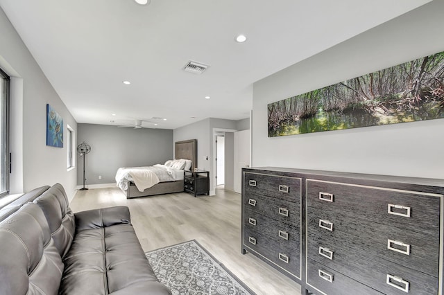 bedroom with light wood finished floors, baseboards, visible vents, multiple windows, and recessed lighting