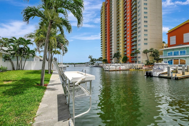 dock area featuring a yard and a water view