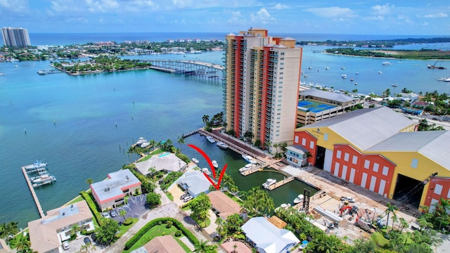 birds eye view of property featuring a view of city and a water view