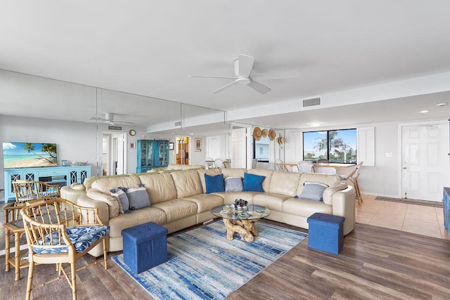 living room with ceiling fan and wood-type flooring