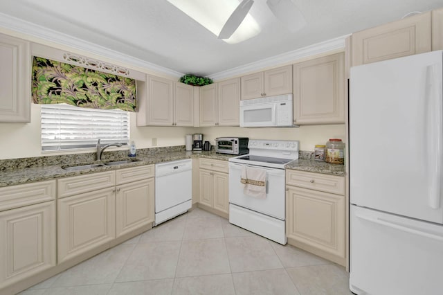 kitchen with white appliances, cream cabinets, sink, and ceiling fan