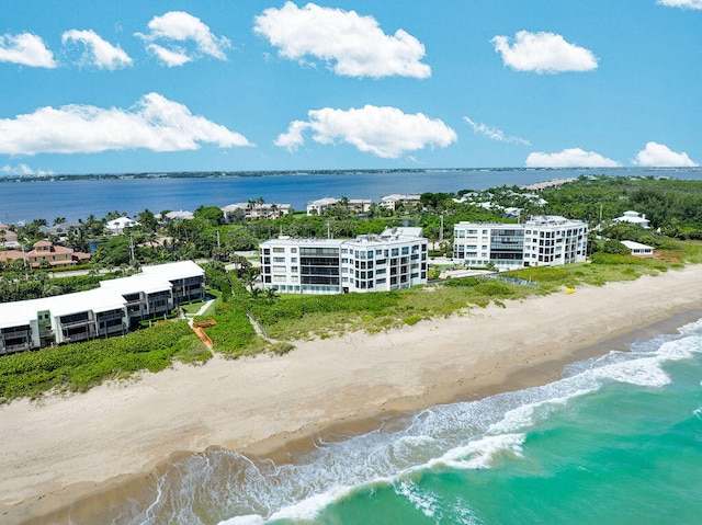 drone / aerial view with a view of the beach and a water view