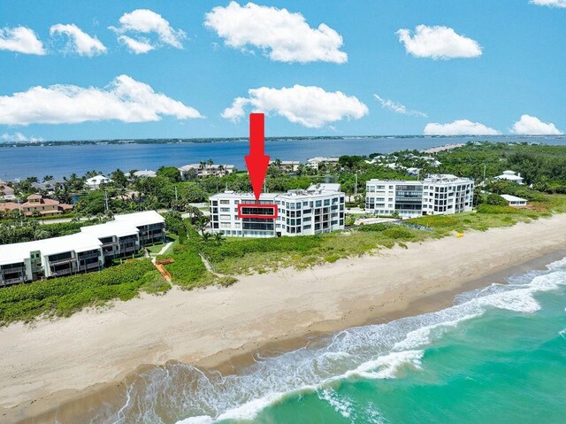 aerial view with a view of the beach and a water view