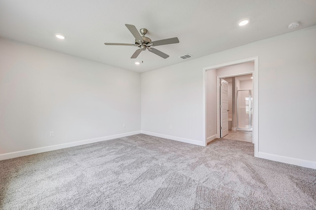 unfurnished room with ceiling fan and light carpet