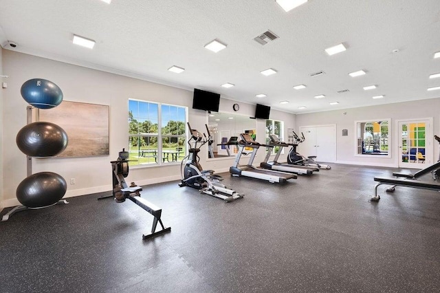 workout area with a textured ceiling