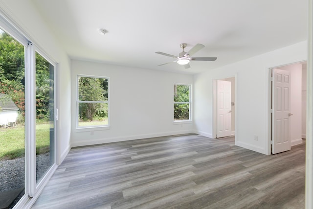 spare room featuring light hardwood / wood-style flooring and ceiling fan