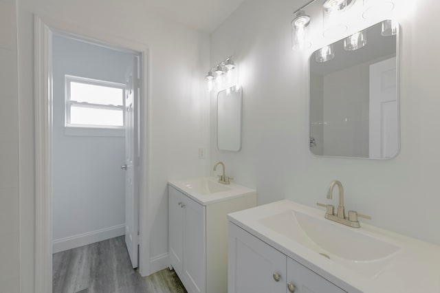 bathroom with vanity and wood-type flooring