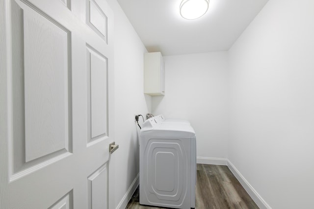 washroom with cabinets, electric dryer hookup, and dark hardwood / wood-style flooring