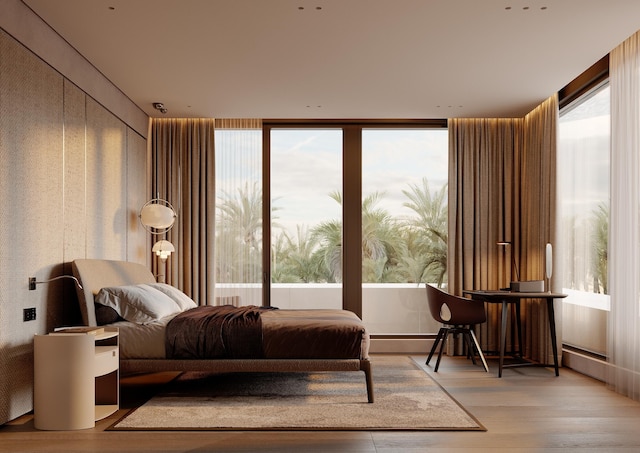 bedroom featuring light hardwood / wood-style flooring and a baseboard radiator