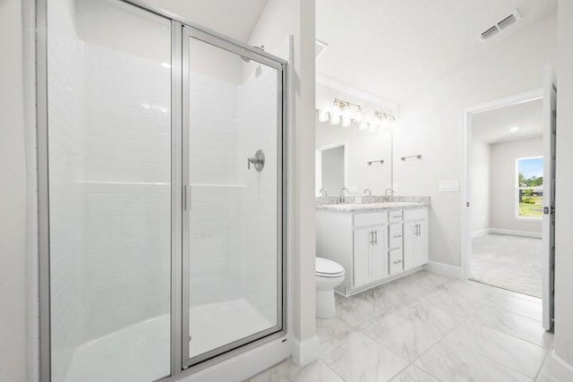 bathroom with vanity, a shower with shower door, vaulted ceiling, and toilet