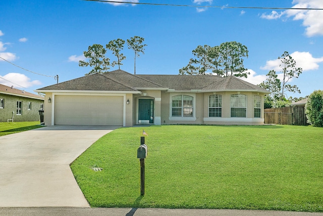 single story home featuring a front lawn and a garage