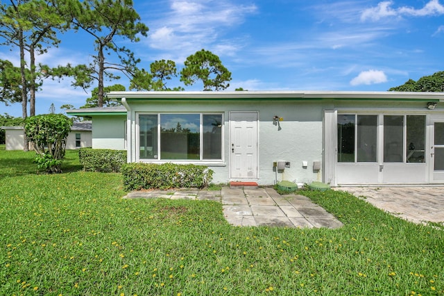 5020 Petal Pl Unit D, Delray Beach, FL 33484 - back of house featuring stucco siding, a yard, and a patio area