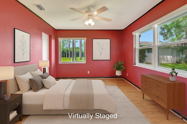 5020 Petal Pl Unit D, Delray Beach, FL 33484 - bedroom featuring light wood finished floors and a ceiling fan