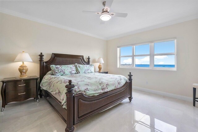 bedroom featuring a water view, ceiling fan, and crown molding