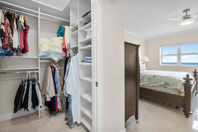 walk in closet with ceiling fan