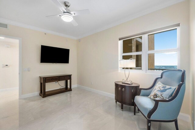 living area featuring crown molding and ceiling fan