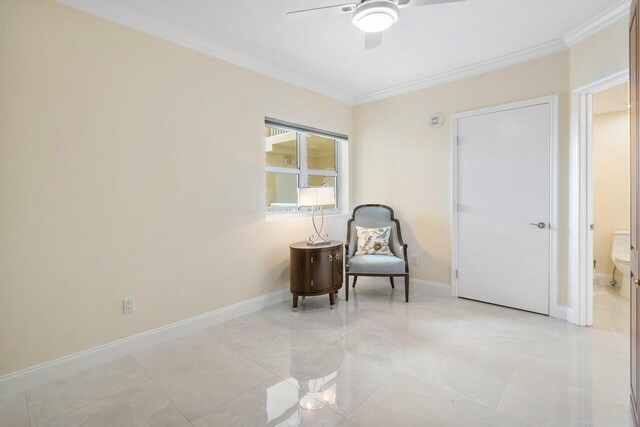 living area featuring crown molding and ceiling fan