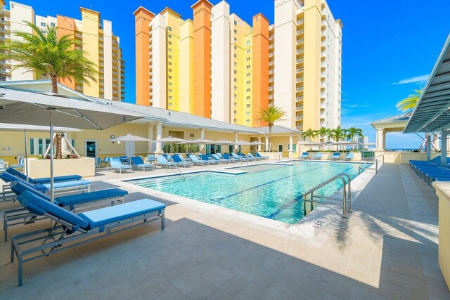 view of swimming pool with a patio area