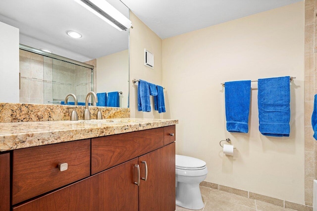 bathroom featuring an enclosed shower, tile patterned floors, toilet, and vanity