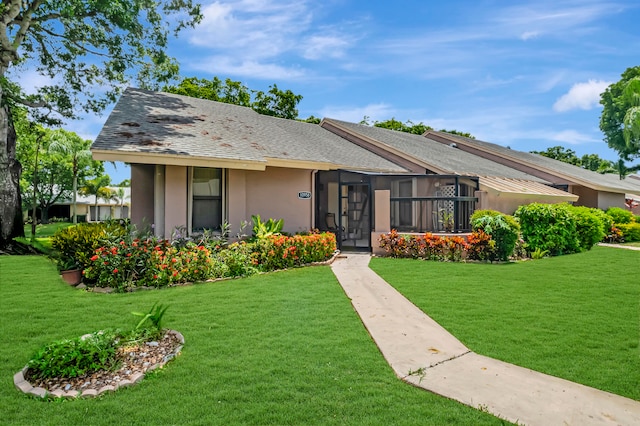 view of front of home with a front lawn