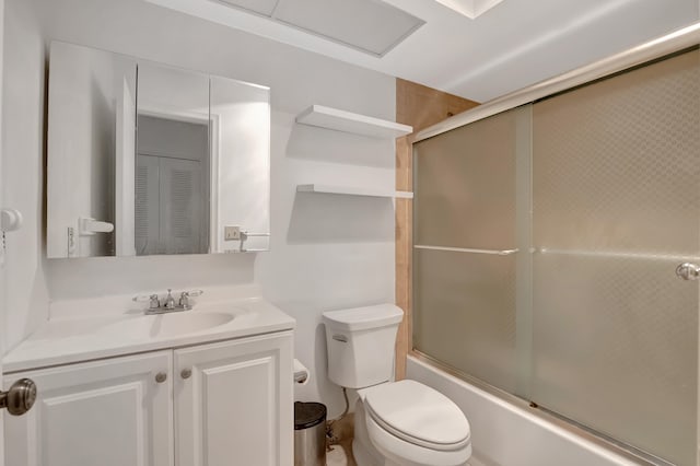 full bathroom with toilet, shower / bath combination with glass door, and vanity