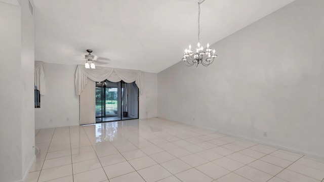 empty room featuring vaulted ceiling, ceiling fan with notable chandelier, and light tile patterned flooring