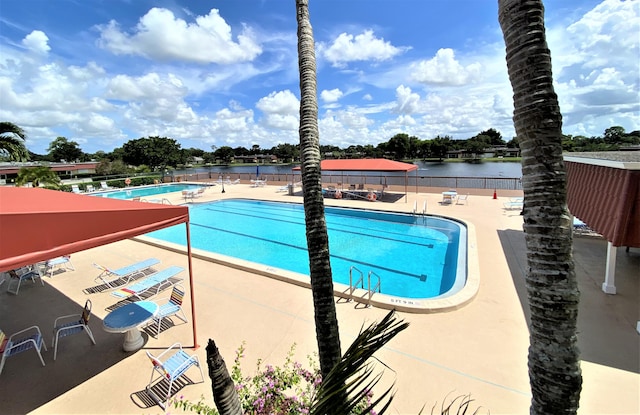 view of swimming pool featuring a patio area