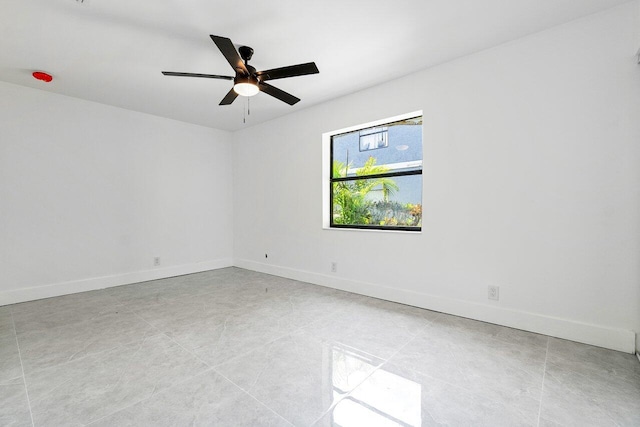 unfurnished room featuring ceiling fan and light tile patterned floors