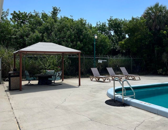 view of swimming pool with a patio area